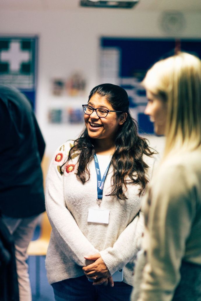 Student smiling with a group of friends