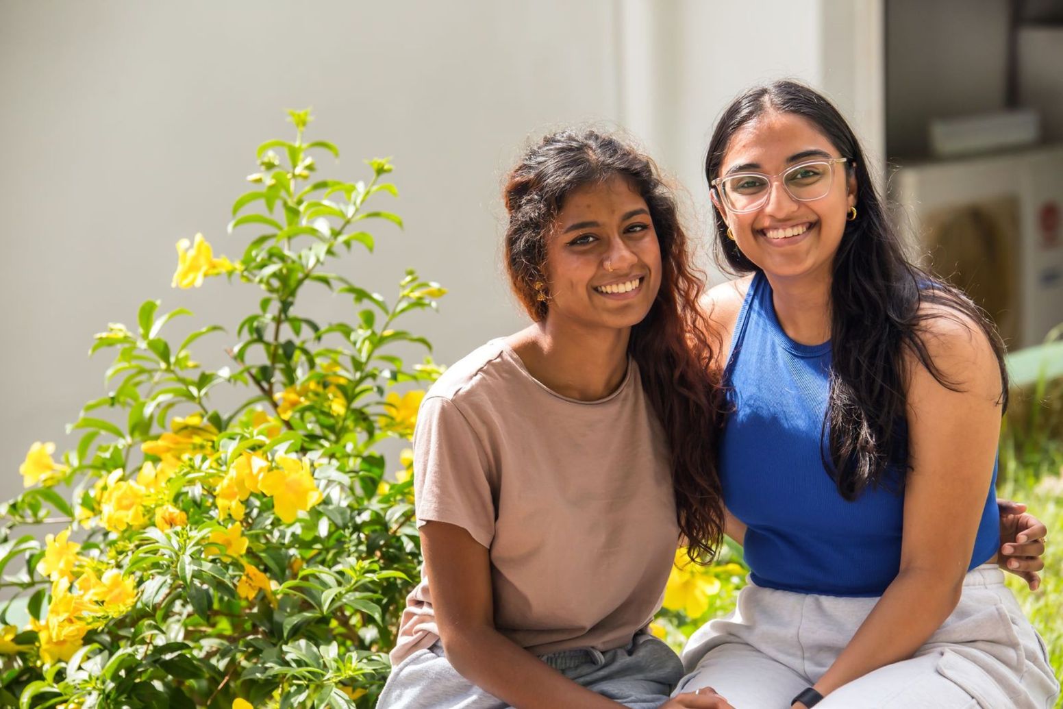 Two students smiling.