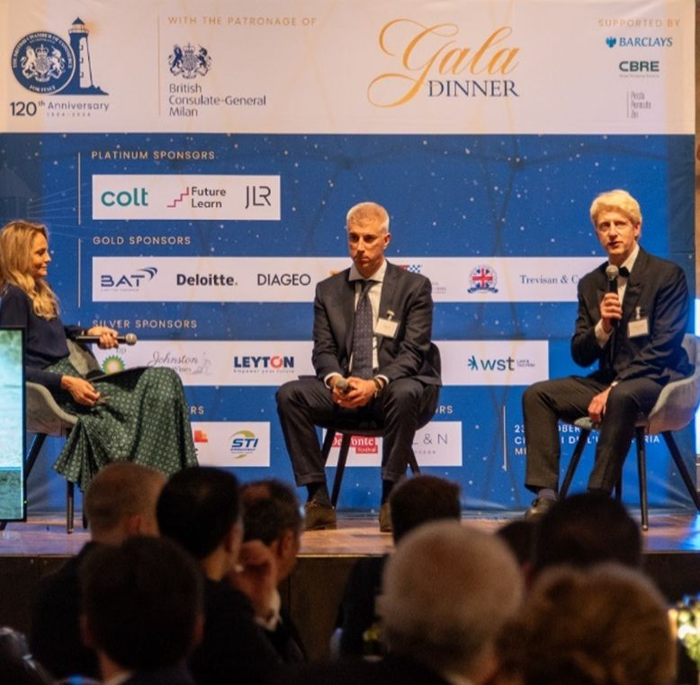 FutureLearn Executive Chairman, Lord Jo Johnson and two others speaking in a panel discussion.