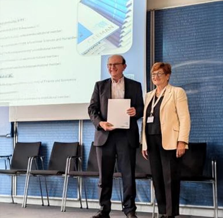 Two people presenting an agreement.