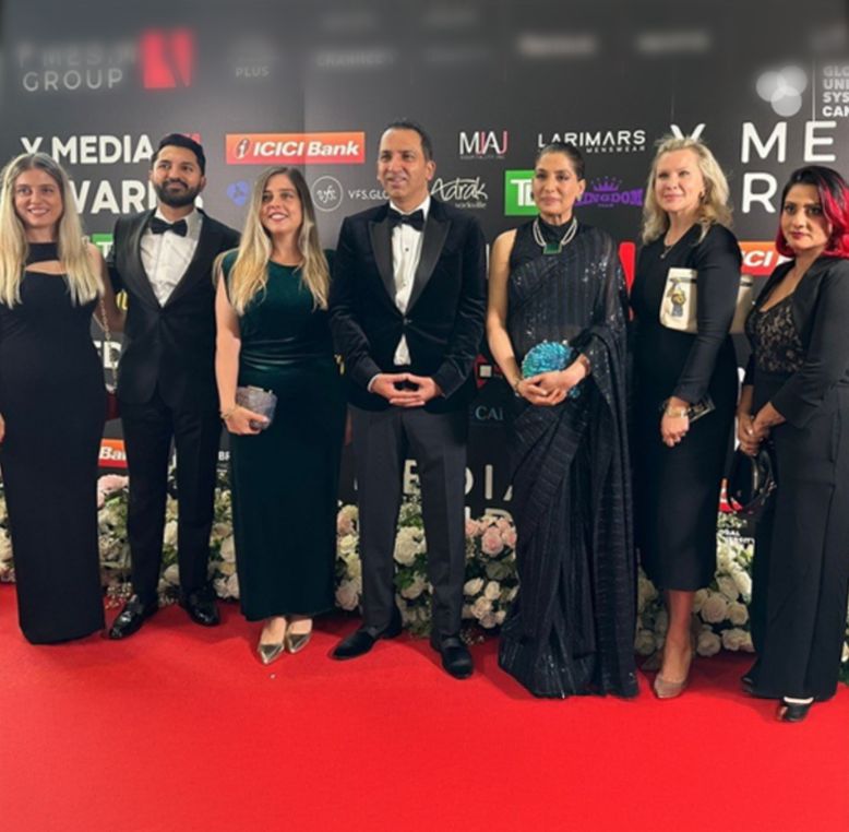 A group of people smartly dressed at the Prestigious Y Media Awards ceremony