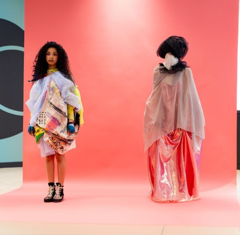 LCCA students modeling on a fashion runway, showcasing their designs or participating in a fashion event.