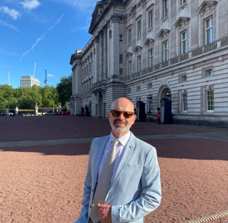 Anthony Hamer-Hodges, Principal of the London College of Contemporary Music, outside of Buckingham Palace.