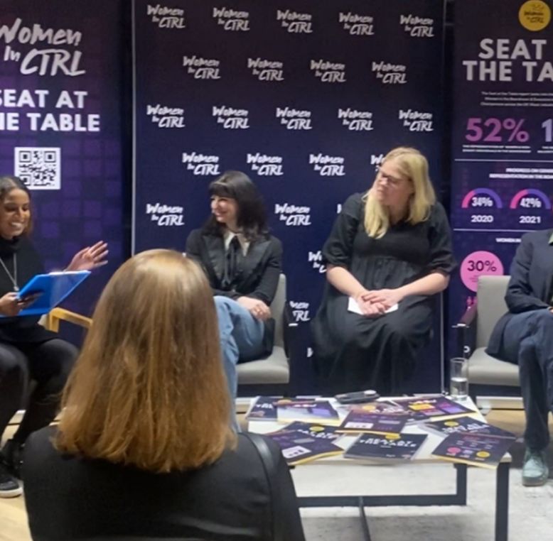 A panel of speakers at a 'Women in CTRL' 'Seat at the Table' event.