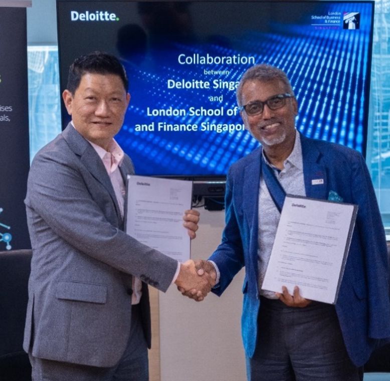 Rathakrishnan Govind, CEO of LSBF Global shaking hands with a representative from Deloitte to signify new collaboration.