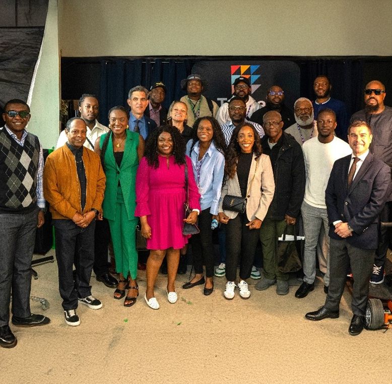 Group of Nigerian delegates smiling.