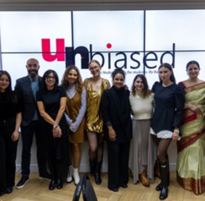 Team photo in front of the "unbiased" project logo.