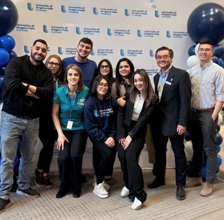 Group of students from University of Niagara Falls smiling and looking at the camera