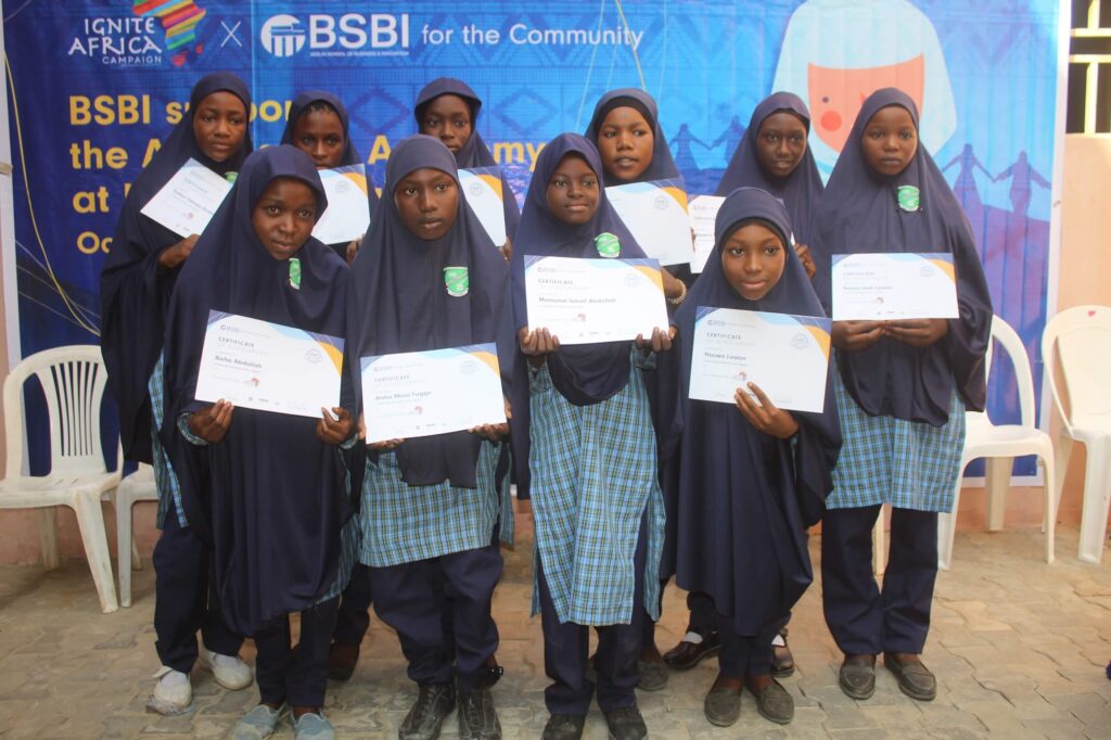 A group of women holding certificates.