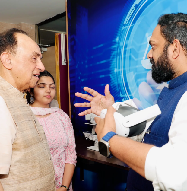 Two individuals from UPES engaged in conversation.