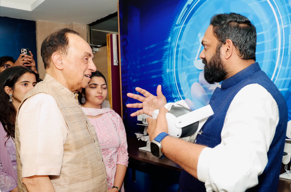 Two individuals from UPES engaged in conversation.