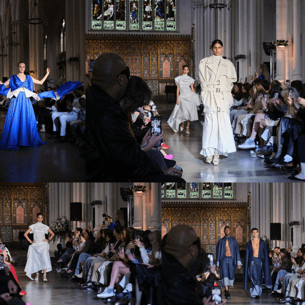 Fashion show runway in cathedral with models.