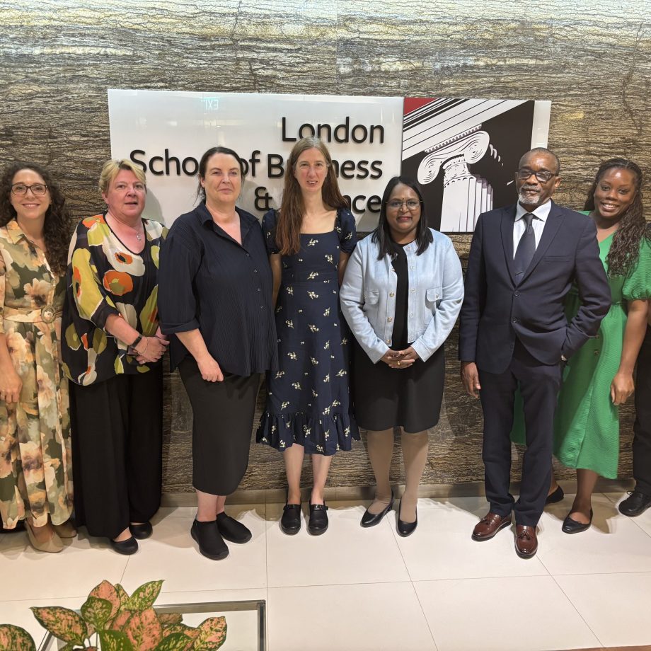 Group of professionals posing together at London School of Business & Finance Singapore campus.