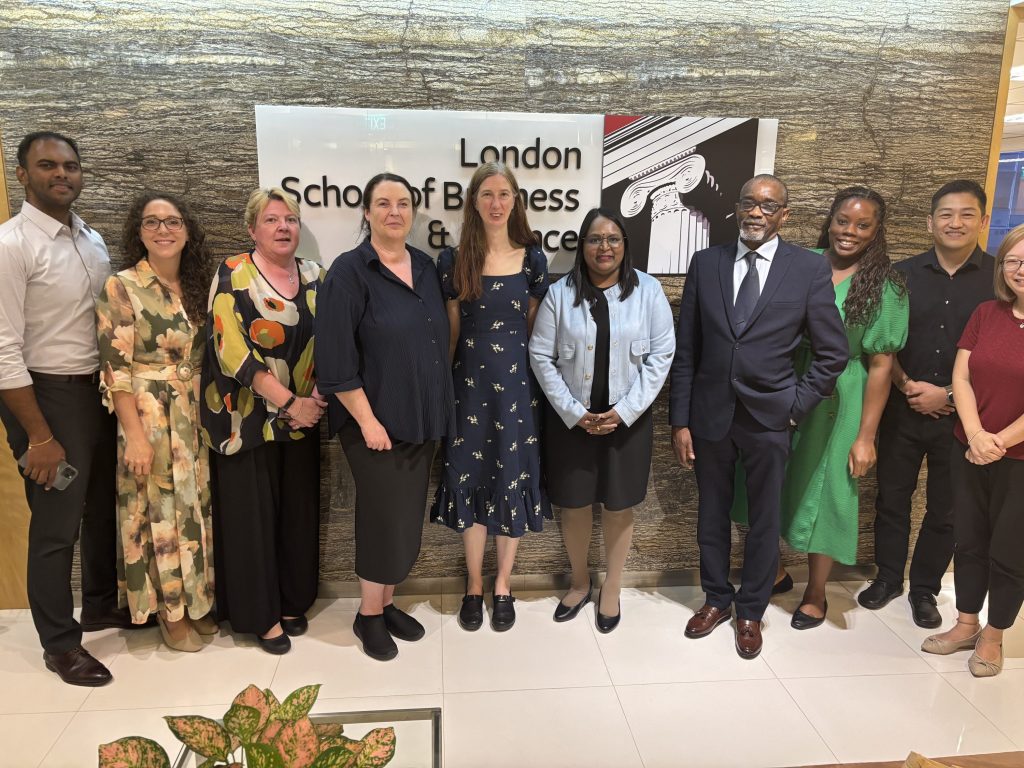 Group of professionals posing together at London School of Business & Finance Singapore campus.