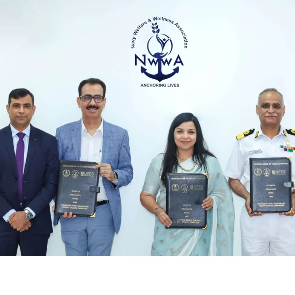 Four people holding certificates at NWWA (Navy Welfare & Wellness Association) ceremony.