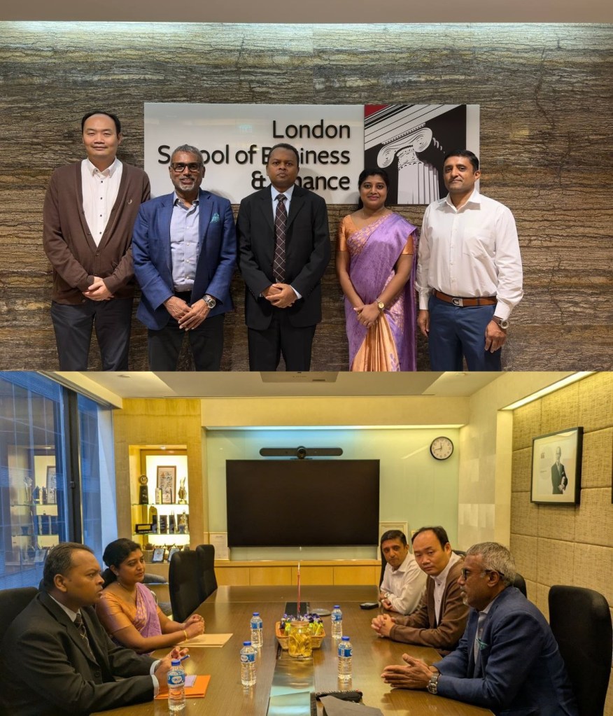 Five professionals posing in front of London School of Business & Finance signage.