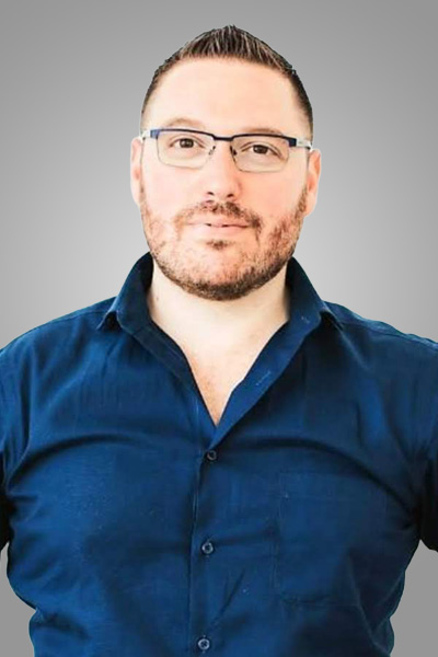 a man wearing glasses and blue shirt