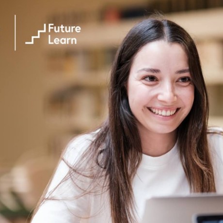 Student using a laptop with Università Cattolica del Sacro Cuore and FutureLearn logos.