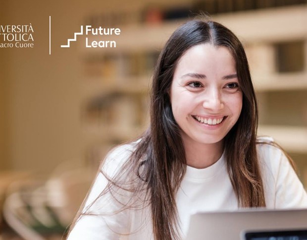 Student using a laptop with Università Cattolica del Sacro Cuore and FutureLearn logos.